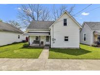 Charming two-story home with a cozy front porch and swing at 223 Grove St, Greenfield, IN 46140
