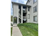 Exterior view of condo with stairway and attractive landscaping surrounding the building at 2967 Eagles Crest Cir # C, Indianapolis, IN 46214