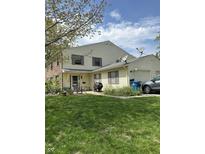 Charming two-story home with a well-manicured lawn, patio, and brick and siding details at 4402 Mountbatten Ct, Indianapolis, IN 46254
