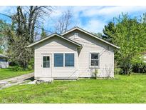 Charming bungalow featuring vinyl siding, a tidy front lawn, and a cozy, welcoming exterior at 4941 Mathews Ave, Indianapolis, IN 46227
