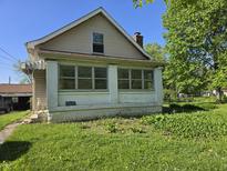 Charming home featuring a bright sunroom and ample natural light at 5103 W Vermont St, Indianapolis, IN 46224