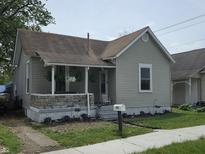 Charming single-story home featuring a cozy front porch and well-maintained landscaping at 533 W Pike St, Martinsville, IN 46151
