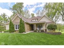 Charming home with stone and siding, manicured lawn, and mature trees at 6340 W 800 S, Pendleton, IN 46064
