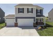 Beautiful home with a two-car garage and well-manicured lawn at 192 Bluestem Ln, Whiteland, IN 46184