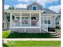 Charming two-story home with a welcoming front porch and well-maintained lawn at 223 E Fordice St, Lebanon, IN 46052