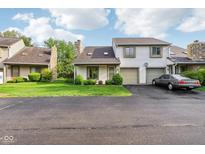 Charming condo with a single car garage and well manicured lawn at 2430 Spring Hill Ct, Indianapolis, IN 46268