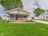 Charming single-story home featuring a cozy front porch and well-maintained lawn at 3140 W 18Th St, Anderson, IN 46011