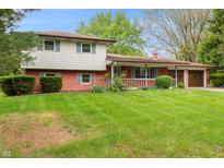 Charming two-story home with brick and vinyl siding and well-maintained lawn at 8140 Valley Estates Dr, Indianapolis, IN 46227