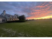Stately home with large lawn and beautiful sunset views at 9909 E Mcgregor Rd, Indianapolis, IN 46259