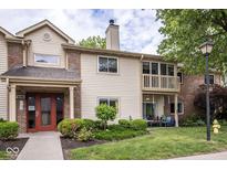 Charming condo with inviting entryway, balcony, and manicured lawn offering a cozy outdoor living space at 1046 Timber Creek Dr # 3, Carmel, IN 46032