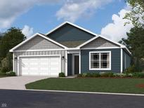 Charming single-Gathering home with a two-car garage, a well-maintained lawn, and stylish, modern architecture at 1400 Bluebonnet Pl, Shelbyville, IN 46176