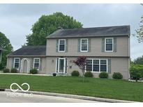 Charming two-story home featuring a well-manicured lawn and classic architectural design at 3829 Waycross Dr, Columbus, IN 47203