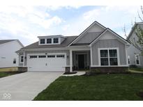 Charming single-Gathering home features a two-car garage, well-manicured lawn, and classic architectural details at 3998 Bozeman Way, Bargersville, IN 46106