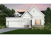 Charming modern farmhouse featuring white siding, stone accents, and a two-car garage at 13355 Seven Springs Ln, Noblesville, IN 46060