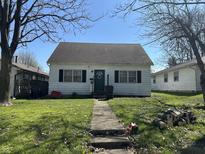 Charming single-story home with a well-maintained front lawn and inviting entryway at 2710 Fairview St, Anderson, IN 46011