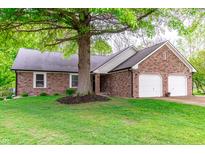 Charming brick ranch-style home with a well-manicured lawn and attached two car garage at 378 Turnberry Ct, Avon, IN 46123