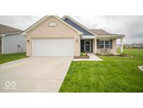 Charming single-story home with brick facade, attached garage, and well-maintained lawn at 505 Shallowroot Ln, Sheridan, IN 46069