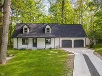 Charming two-story home with a well-maintained lawn and a two-car garage at 6682 English Dr, Avon, IN 46123