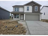 Two-story home with gray-tone accents, white siding, and a two-car garage at 11302 N Quillow Way, Monrovia, IN 46157