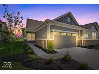 Charming single-story home featuring a two-car garage, landscaped yard, and modern exterior at 11469 Lottie Cir, Noblesville, IN 46060