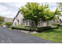 Charming home showcasing a well-maintained exterior with stone accents and mature landscaping at 16628 Brownstone Ct, Westfield, IN 46074