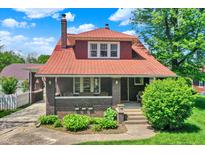 Charming two-story home with a brick facade, covered front porch, and well-manicured landscaping at 3744 S Meridian St, Indianapolis, IN 46217