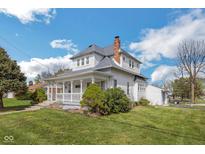Charming two-story home with a welcoming front porch and well-maintained lawn, perfect for relaxing outdoors at 4429 Iowa St, Clayton, IN 46118