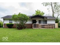 Charming single-story home with a brick foundation and a well-maintained front yard at 5605 Glencoe St, Indianapolis, IN 46226