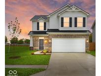 Beautiful two-story home featuring a two-car garage and manicured front lawn at 576 Plowman Dr, Shelbyville, IN 46176