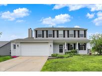 Charming two-story home featuring white-painted brick, a well-manicured lawn, and inviting curb appeal at 6624 Lakestone Ct, Indianapolis, IN 46237