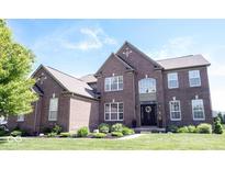 Beautiful two-story brick home featuring manicured lawn and landscaping at 10267 Ranford Blvd, Fishers, IN 46040