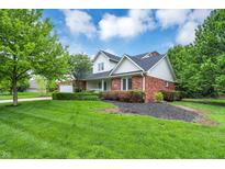 Charming two-story brick home featuring manicured landscaping and a well-maintained lawn at 3996 Brockton Manor N Dr, Greenwood, IN 46143