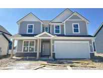 Charming two-story home with gray siding, white trim, and an attached two-car garage, perfect for suburban living at 6306 Countryside Forge Way, Indianapolis, IN 46259