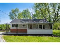 Charming single-story home with a screened porch, brick foundation, and a well-maintained front yard at 11600 N 100 E, Morristown, IN 46161
