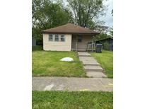 Charming single-story home with a well-maintained lawn and inviting walkway at 2621 N Tacoma Ave, Indianapolis, IN 46218