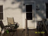 Inviting front porch with seating, perfect for relaxing and enjoying the outdoors at 3049 S Rybolt Ave, Indianapolis, IN 46241