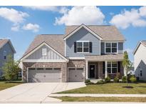 Charming two-story home with blue siding, brick accents, and a spacious two-car garage at 5770 Flagler Ln, Brownsburg, IN 46112