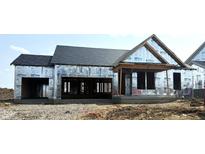 New construction home with a garage and covered porch awaiting finishing touches at 6203 Hampton Walk Blvd, McCordsville, IN 46055