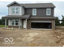 New two-story home featuring a two-car garage and neutral-colored exterior at 7509 Big Bend Blvd, Camby, IN 46113