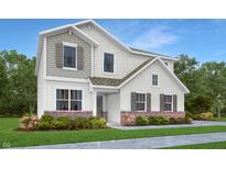 Charming two-story home with a combination of shingle and siding, complemented by a well-maintained front yard at 1127 Marston Ln, Avon, IN 46123