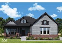 Charming two-story home with a shingle and brick exterior and inviting covered front porch at 11467 Selsey Rd, Fishers, IN 46040