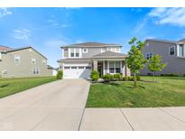 Two-story home with gray siding, stone accents, a two-car garage, and a well-manicured lawn at 1289 Sunset Blvd, Avon, IN 46123