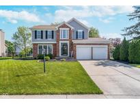 Charming two-story home with brick and gray siding, a well-manicured lawn, and a two-car garage at 13131 Conner Knoll Pkwy, Fishers, IN 46038