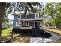 Beautiful two-story home with a welcoming front porch and charming architectural details at 1601 E Edwards Ave, Indianapolis, IN 46227
