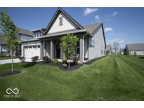 Charming single-Gathering home with a well-manicured lawn and attached two car garage at 345 Ehrlich Ln, Westfield, IN 46074