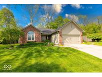 Charming single-Gathering home featuring a brick facade, well-maintained lawn, and attached garage at 1120 Crystal Ct, Avon, IN 46123