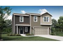 Two-story home featuring mixed siding, an attached garage, and neatly landscaped grounds at 11840 Vale St, Indianapolis, IN 46235