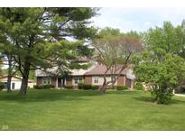 Charming two-story home with brick and siding exterior, mature trees, and a well-manicured lawn at 15203 Shoreway Ct, Carmel, IN 46032