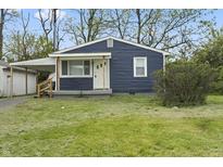 Charming single-story home with a well-maintained lawn and covered carport at 2344 N Leland Ave, Indianapolis, IN 46218