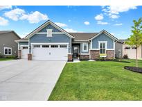 Charming single-Gathering home featuring blue siding, well-maintained landscaping, and a spacious three-car garage at 5248 Holborn Ave, McCordsville, IN 46055